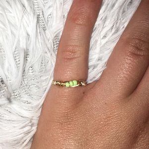 Gold ring with green seed beads